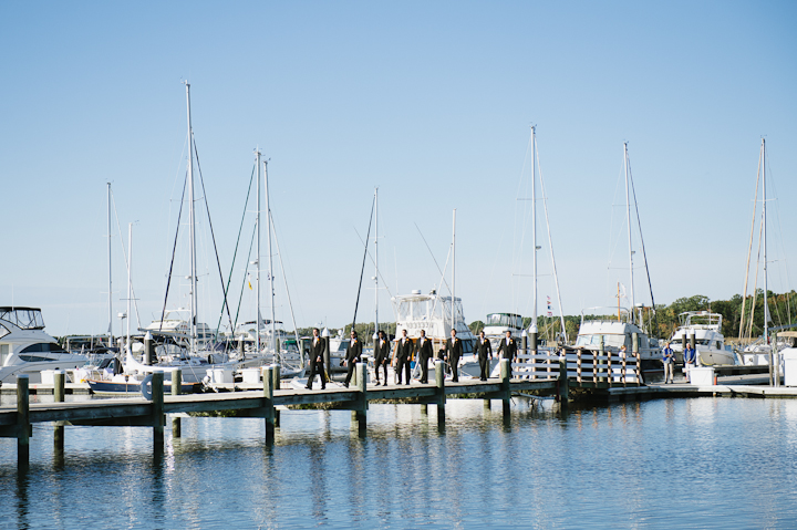 Groomsmen Walking Across the Pier